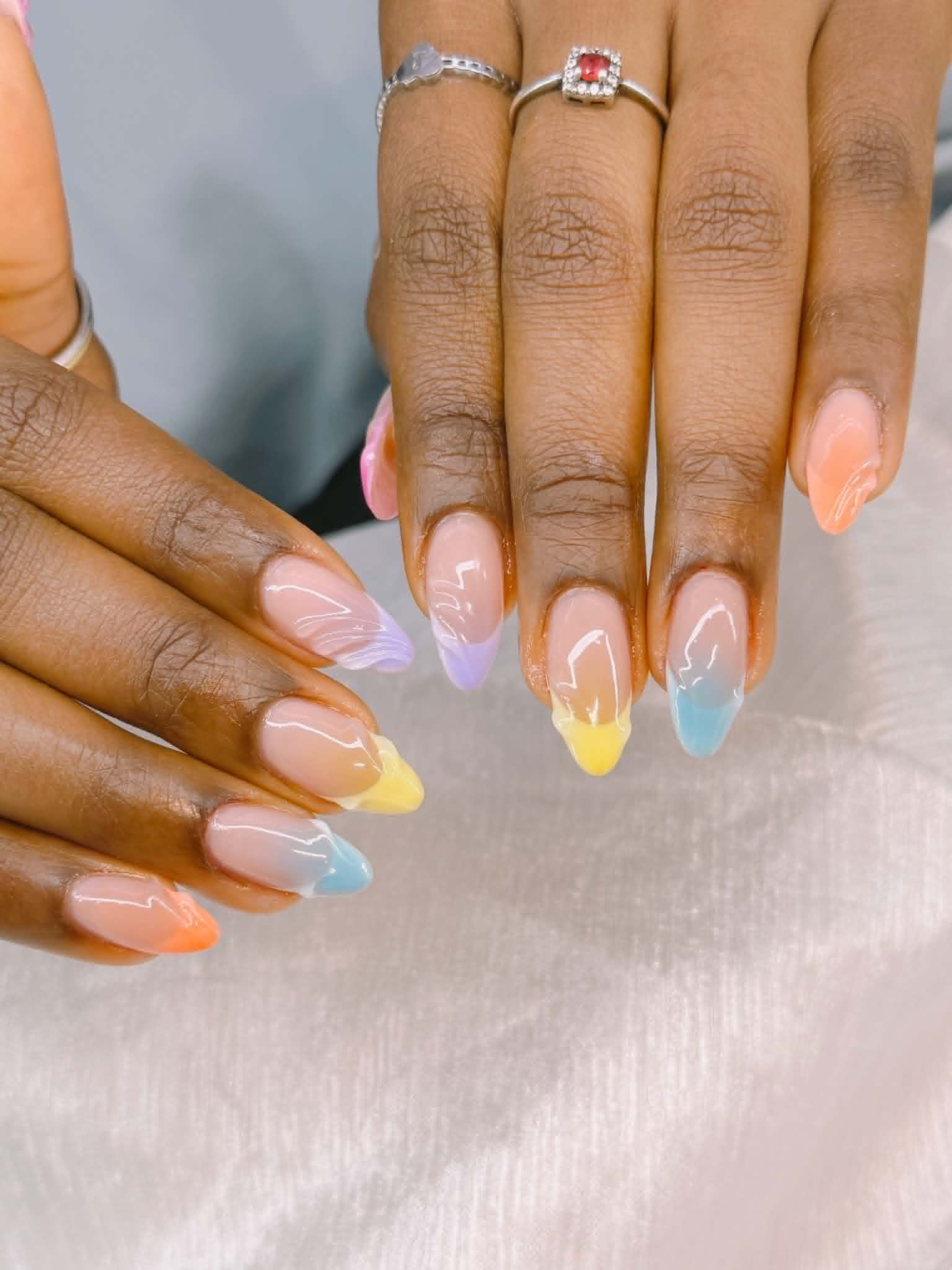 Almond nails with pastel multicolor French tips