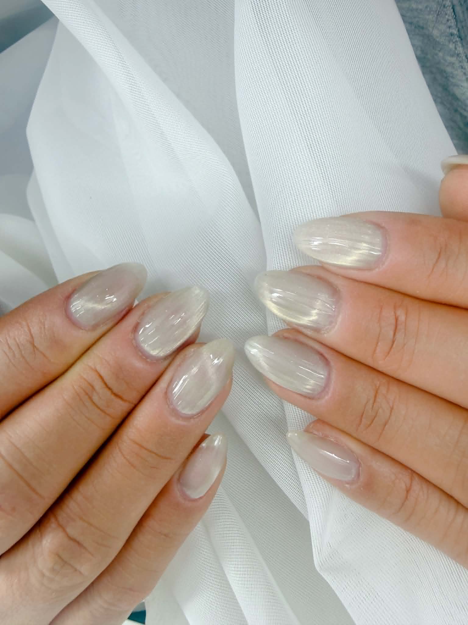 Pearl chrome shimmer almond nails